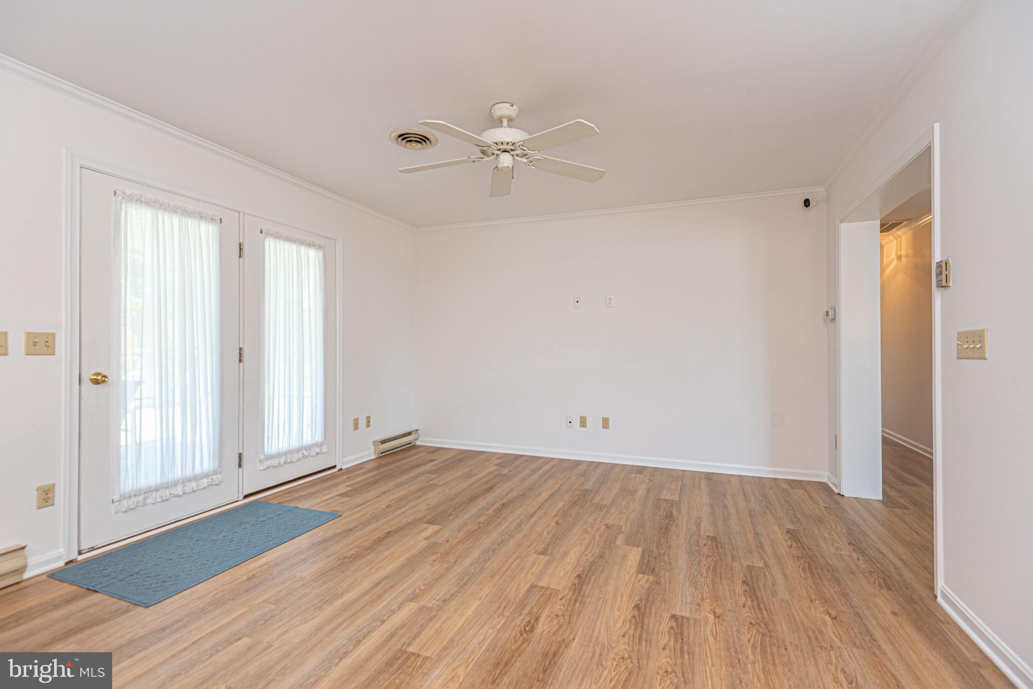 38241 Marlington Road Ocean View, DE 19970 - Photo 13 of 40 wooden floor in an empty room with a window