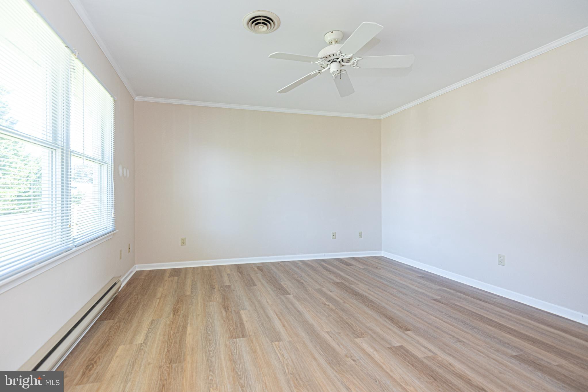 38241 Marlington Road Ocean View, DE 19970 - Photo 15 of 40 wooden floor in an empty room with a window