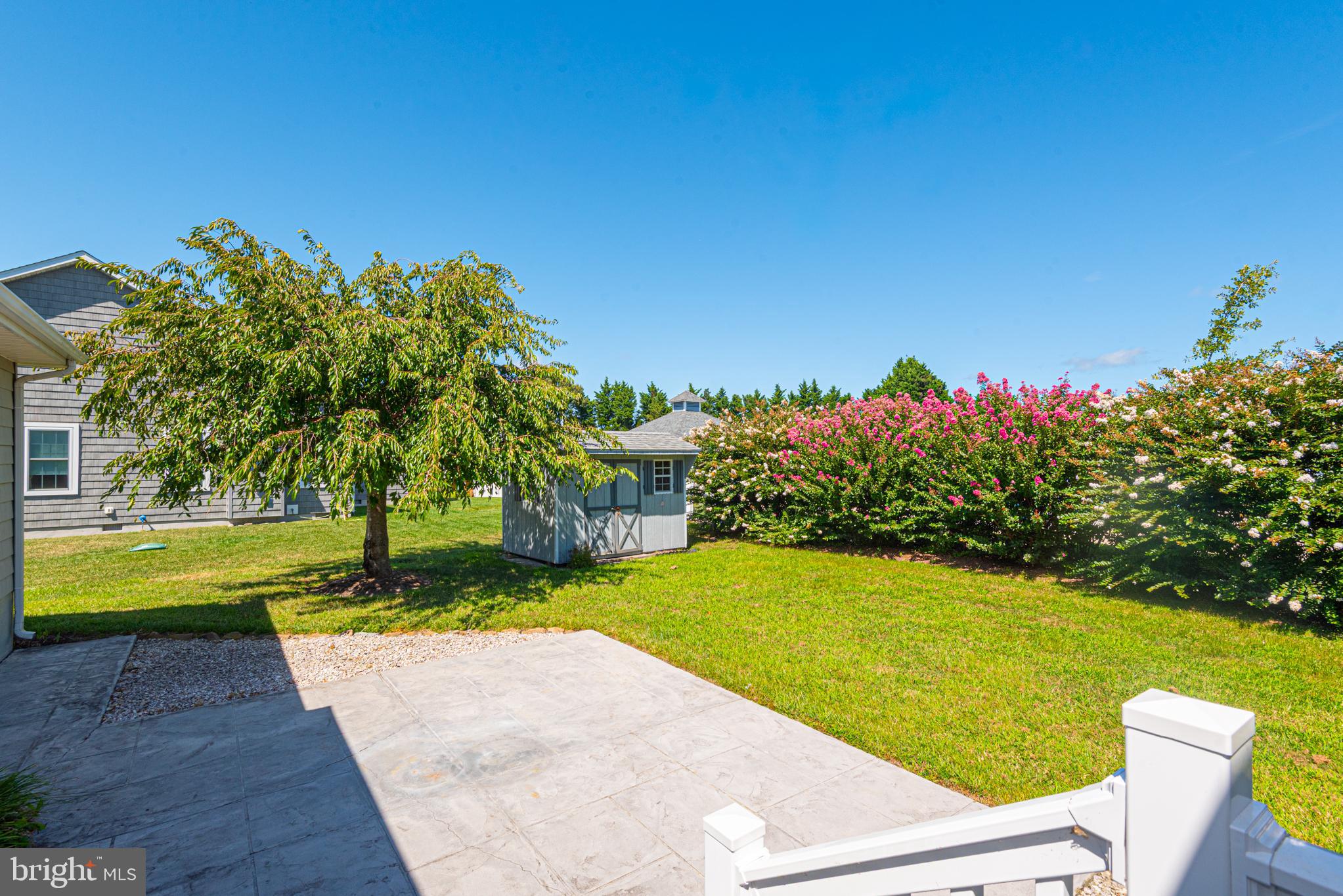 38241 Marlington Road Ocean View, DE 19970 - Photo 27 of 40 a view of a swimming pool with an outdoor space and seating area