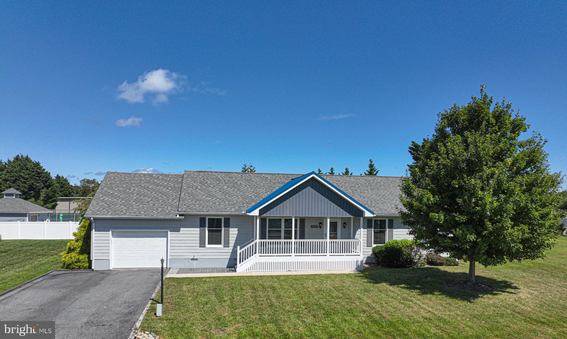 38241 Marlington Road Ocean View, DE 19970 - Photo 3 of 40 a view of a house with a yard and potted plants