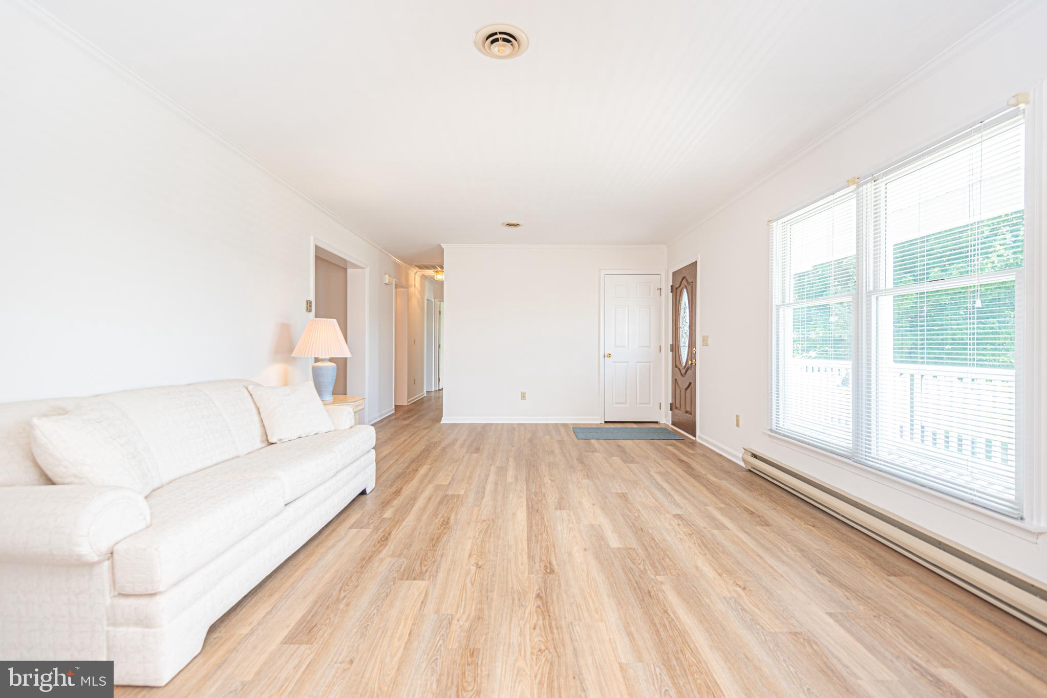 38241 Marlington Road Ocean View, DE 19970 - Photo 5 of 40 a living room with furniture and a large window