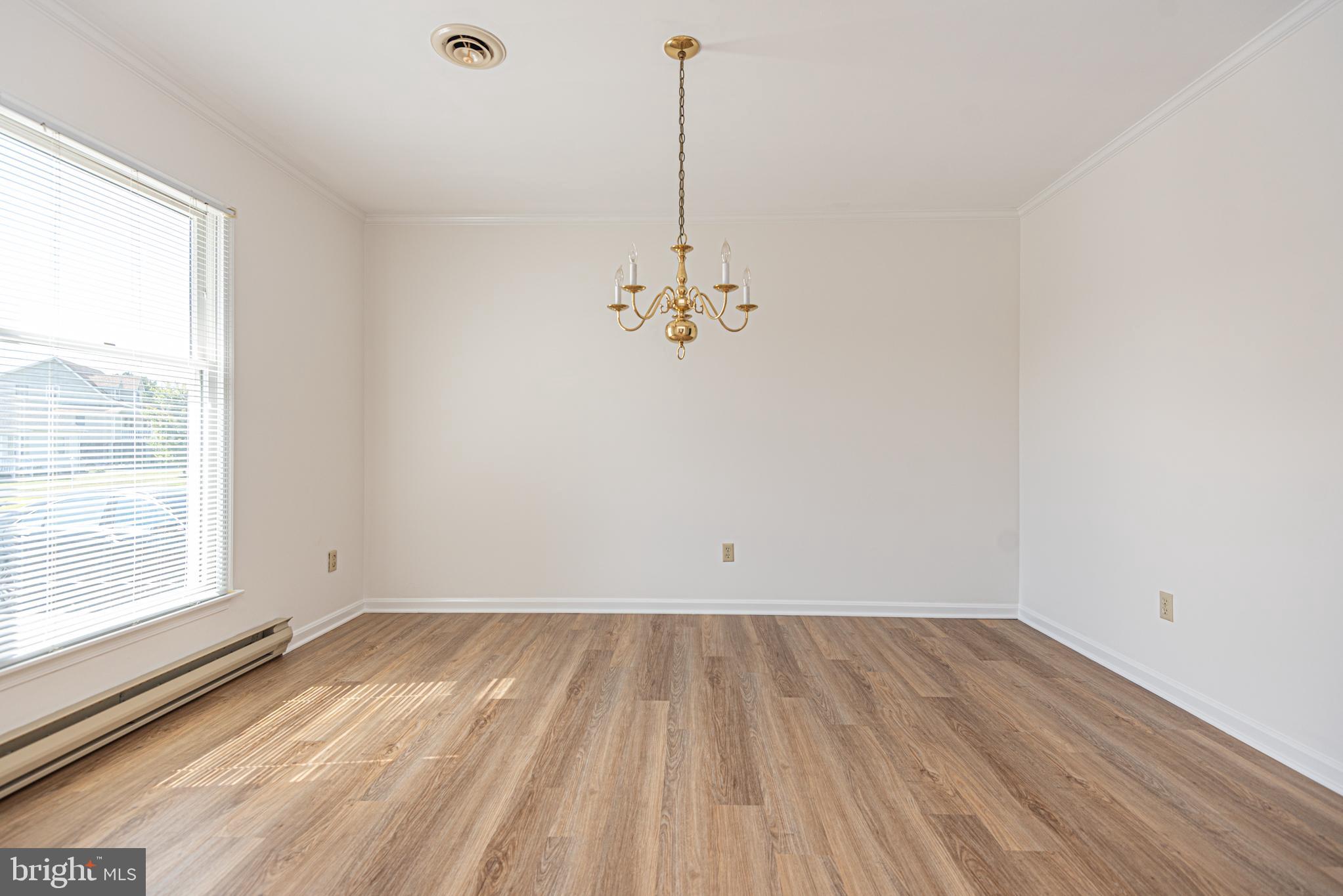 38241 Marlington Road Ocean View, DE 19970 - Photo 9 of 40 a view of a room with wooden floor and window