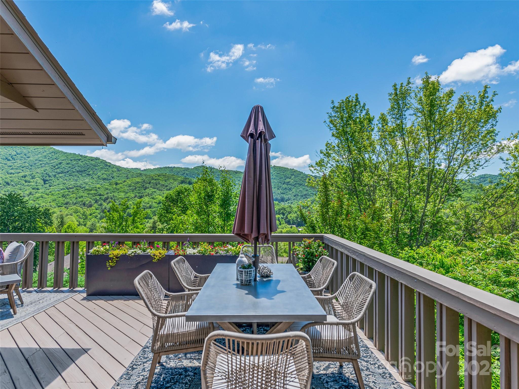36 Stony Ridge Asheville, NC 28804 - Photo 12 of 38 a view of a patio with a table chairs and a table