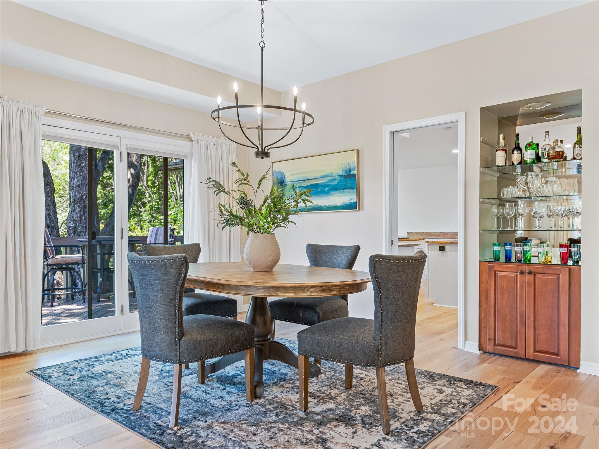 36 Stony Ridge Asheville, NC 28804 - Photo 20 of 38 a dining room with furniture a rug and a chandelier