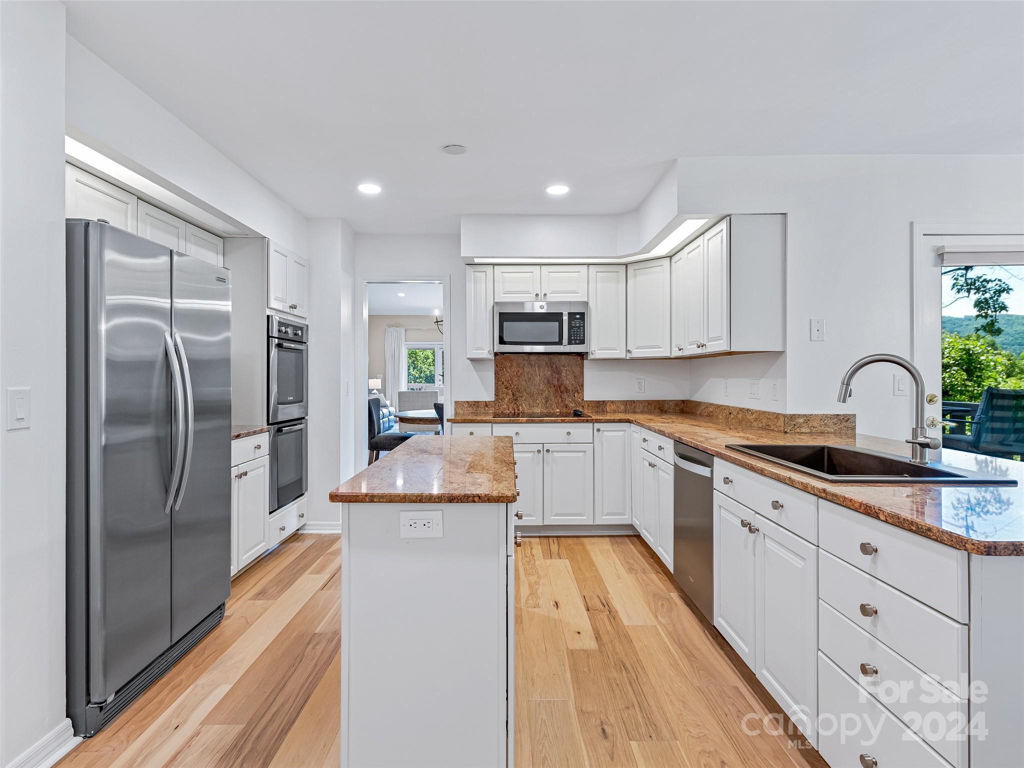 36 Stony Ridge Asheville, NC 28804 - Photo 21 of 38 a large kitchen with stainless steel appliances granite countertop a stove a sink and a refrigerator
