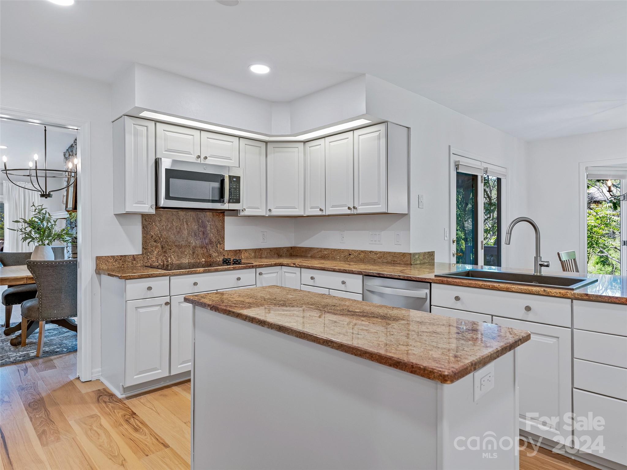 36 Stony Ridge Asheville, NC 28804 - Photo 22 of 38 a kitchen with sink cabinets and microwave