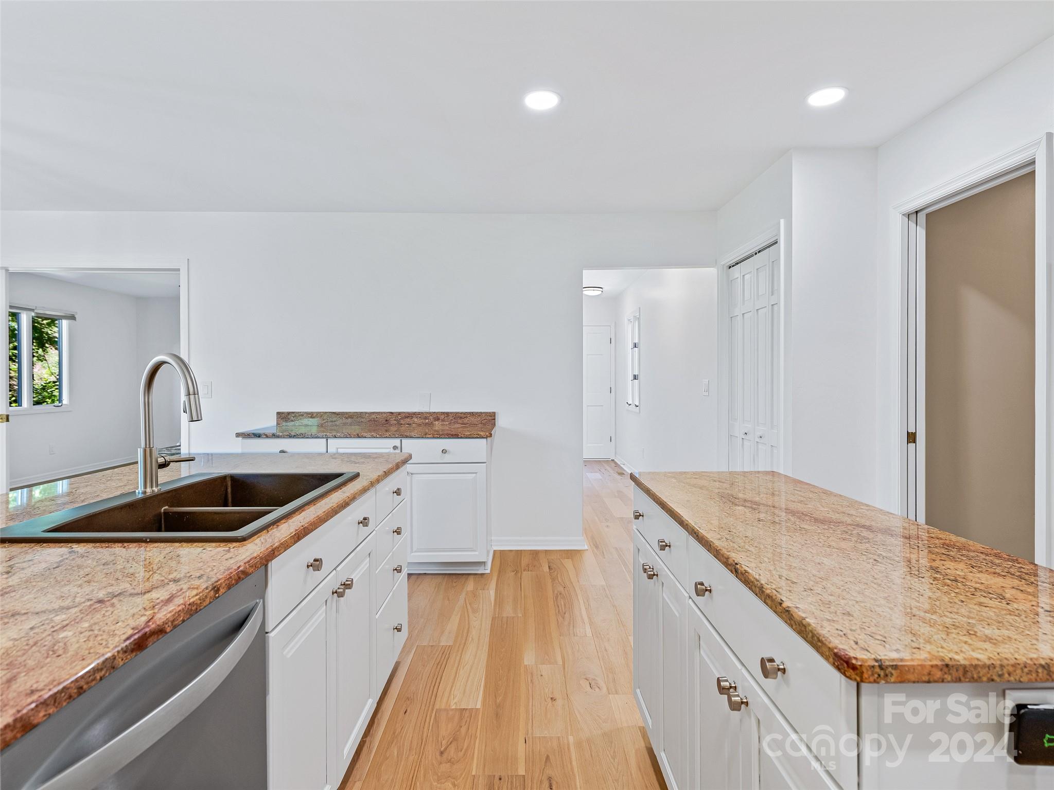 36 Stony Ridge Asheville, NC 28804 - Photo 23 of 38 a kitchen with a sink stove and cabinets