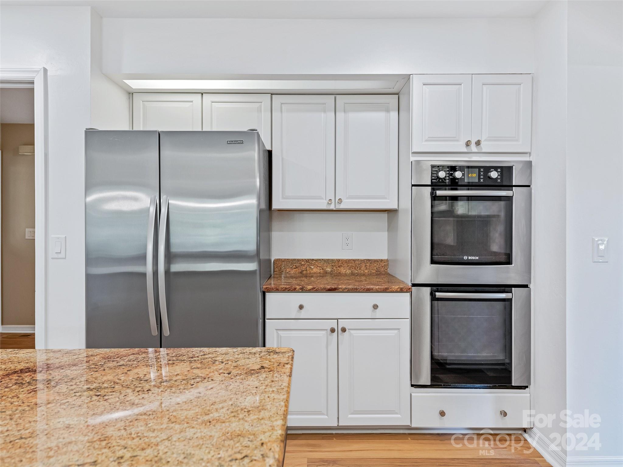 36 Stony Ridge Asheville, NC 28804 - Photo 24 of 38 a kitchen with granite countertop a refrigerator stove and microwave