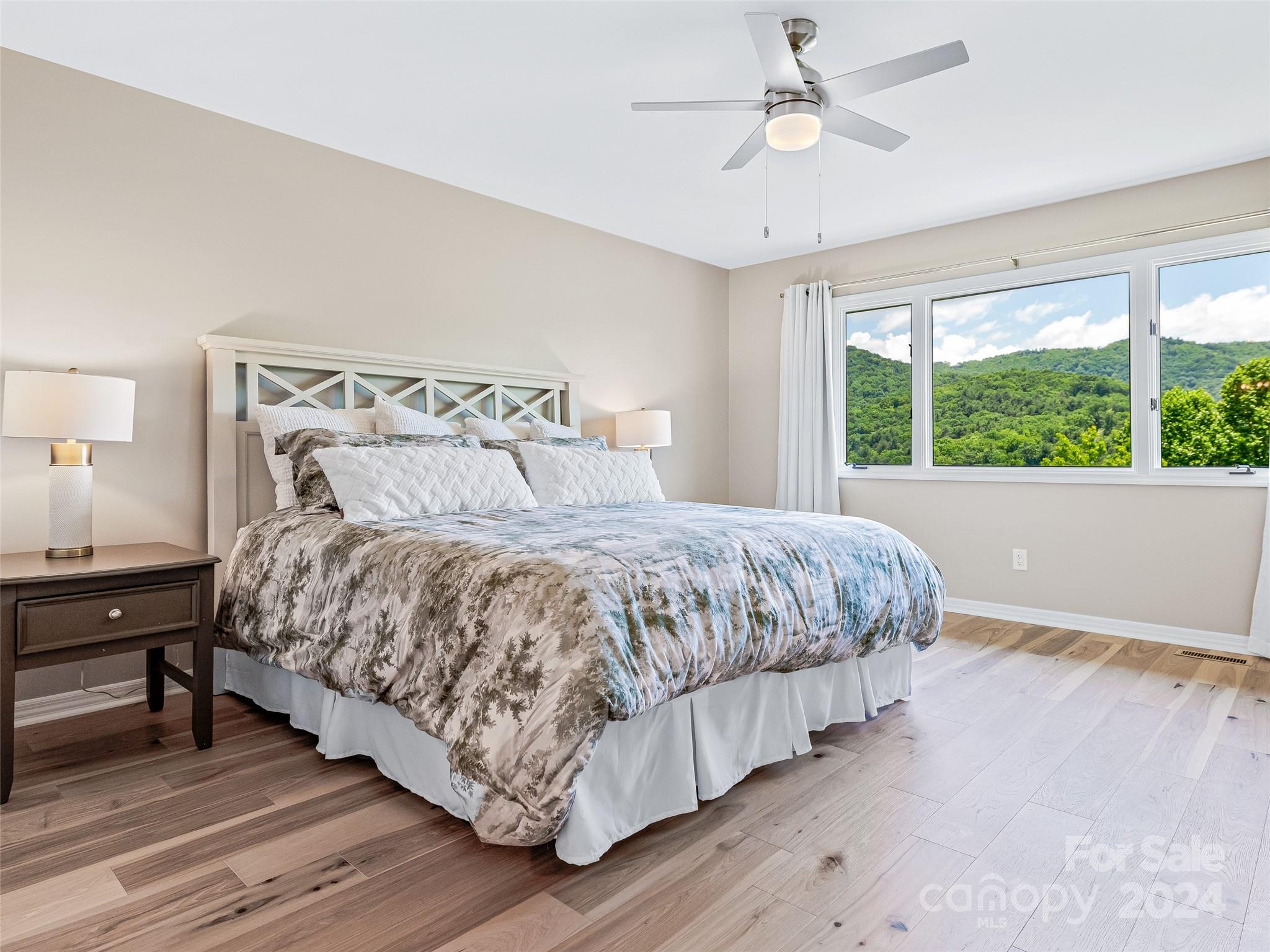 36 Stony Ridge Asheville, NC 28804 - Photo 29 of 38 a bedroom with a bed and wooden floor
