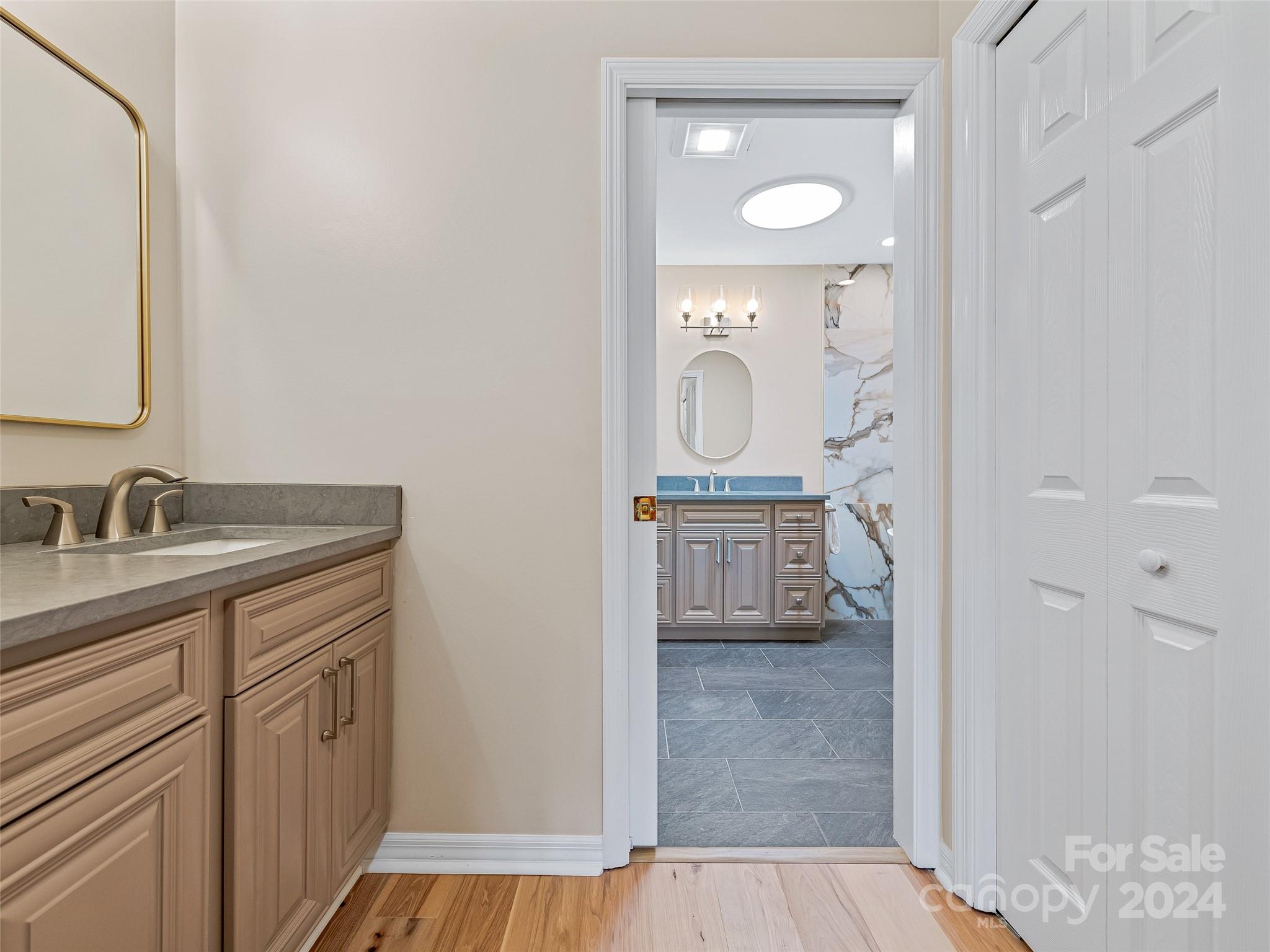 36 Stony Ridge Asheville, NC 28804 - Photo 32 of 38 a bathroom with a granite countertop sink mirror and vanity