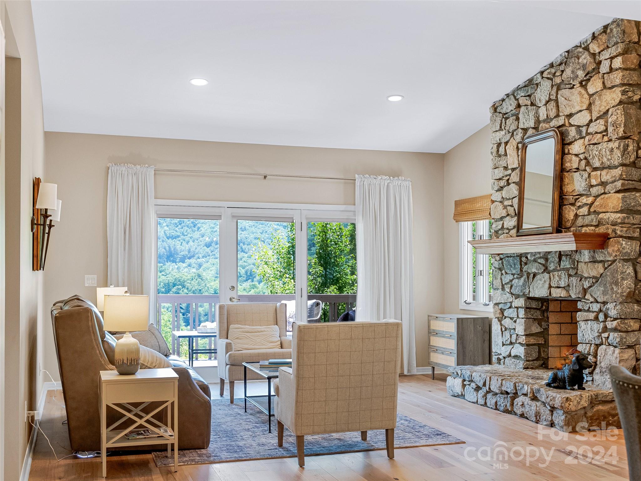 36 Stony Ridge Asheville, NC 28804 - Photo 7 of 38 a living room with fireplace furniture and a large window