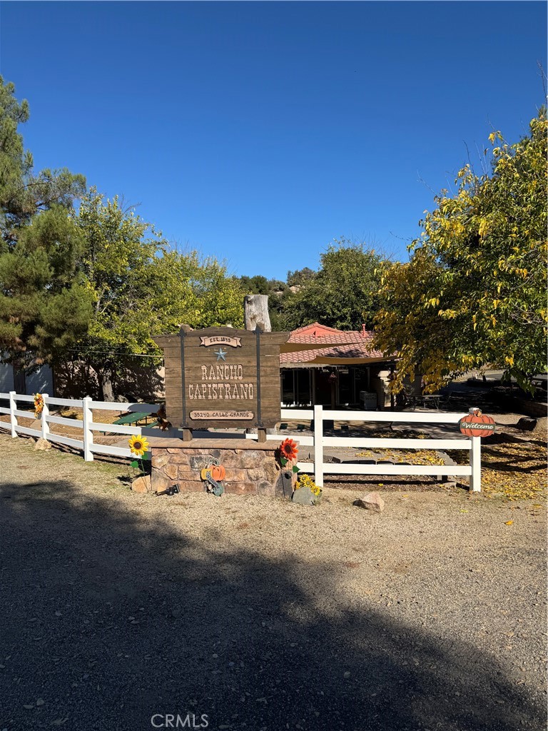 0 Arroyo Road Lake Elsinore, CA 92530 - Photo 31 of 59 a view of swimming pool with outdoor seating and trees in the background