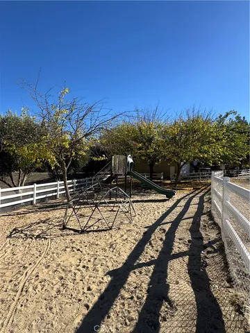 a view of swimming pool with a lounge chair