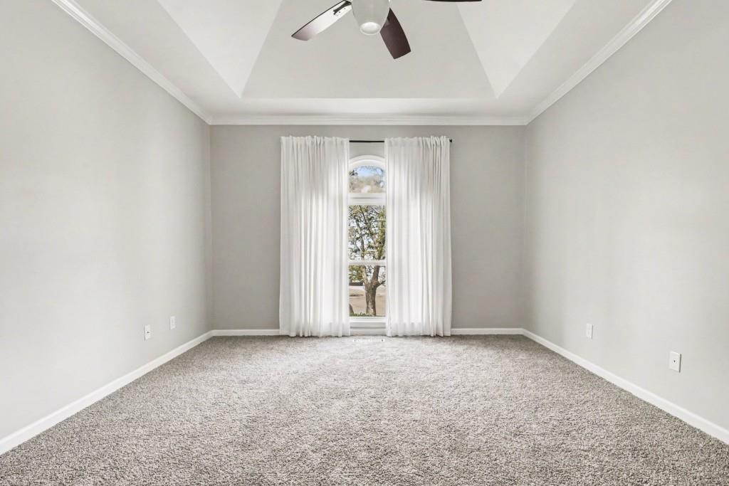 3793 Market Crescent Clarkston, GA 30021 - Photo 22 of 35 an empty room with ceiling fan and window