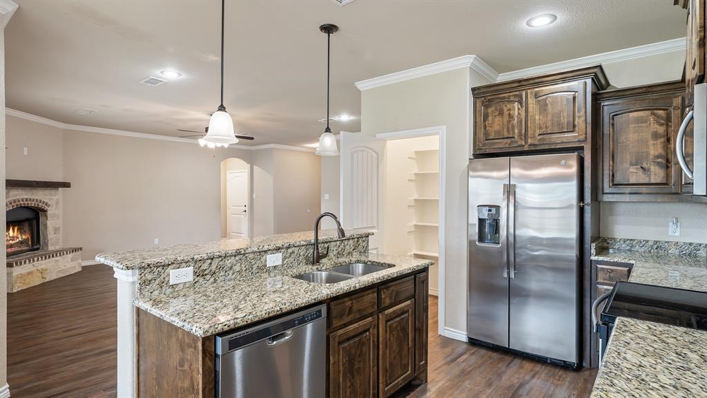 1401 Ridgebriar Drive Kaufman, TX 75142 - Photo 8 of 26 Kitchen featuring open concept to the living room