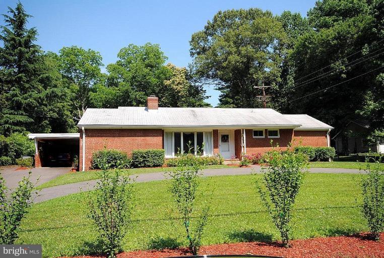 3112 Sleepy Hollow Road Falls Church, VA 22042 - Photo 1 of 20 a front view of a house with garden
