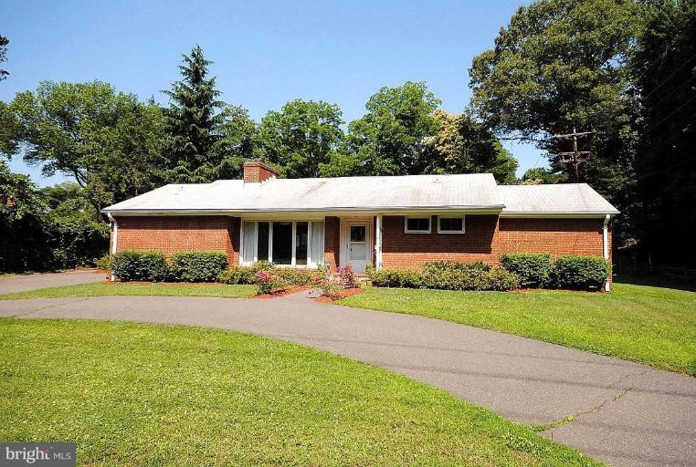 3112 Sleepy Hollow Road Falls Church, VA 22042 - Photo 2 of 20 a front view of a house with a yard and porch