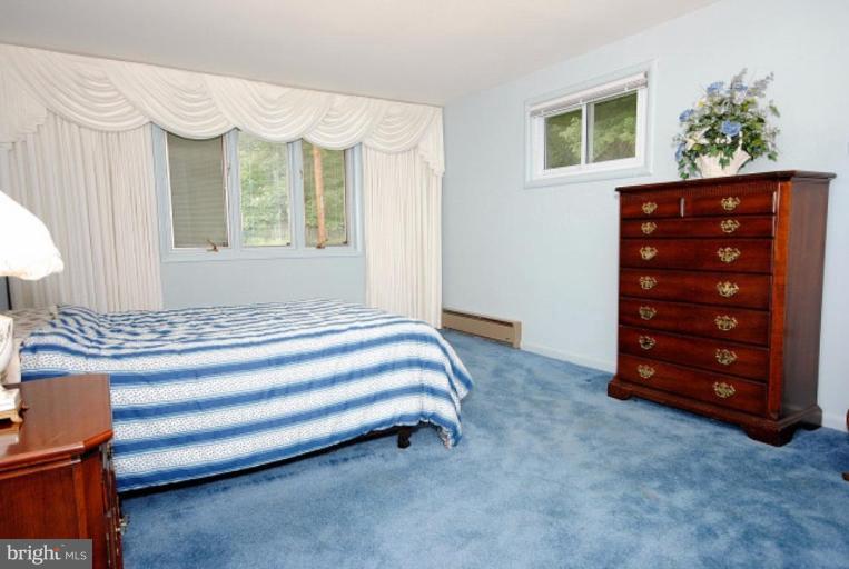 3112 Sleepy Hollow Road Falls Church, VA 22042 - Photo 10 of 20 a spacious bedroom with a bed and a table