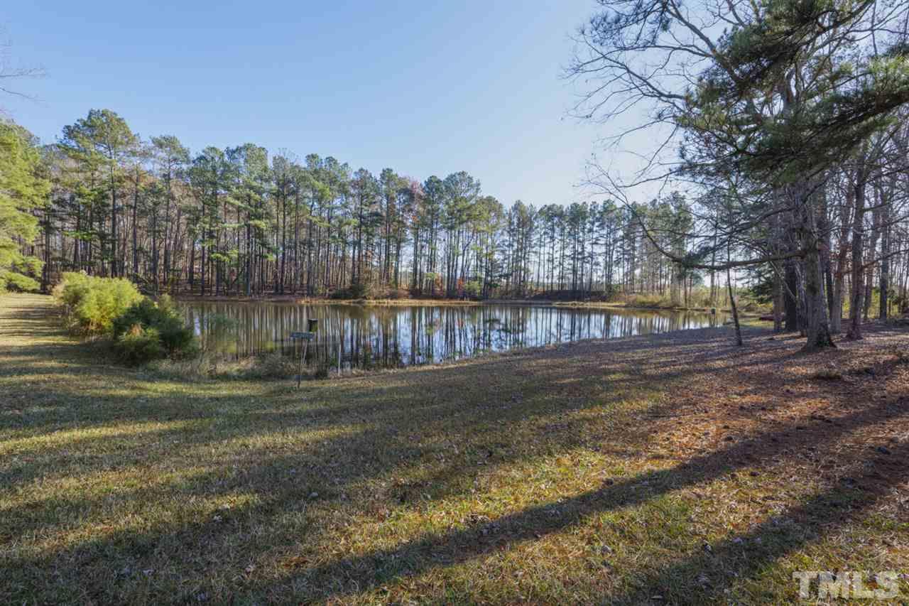 648 Tant Road Spring Hope, NC 27882 - Photo 29 of 30 The Pond is stocked with large mouth bass, catfish, blue gill, crappy, and minnows and has a 100 ton gravel retaining wall.