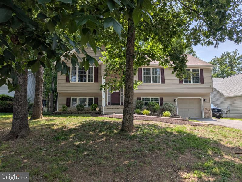 305 Birdie Road Locust Grove, VA 22508 - Photo 64 of 64 a view of a house with a yard