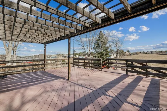 a view of a balcony with wooden floor