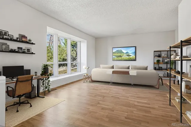 a bedroom with furniture and a window