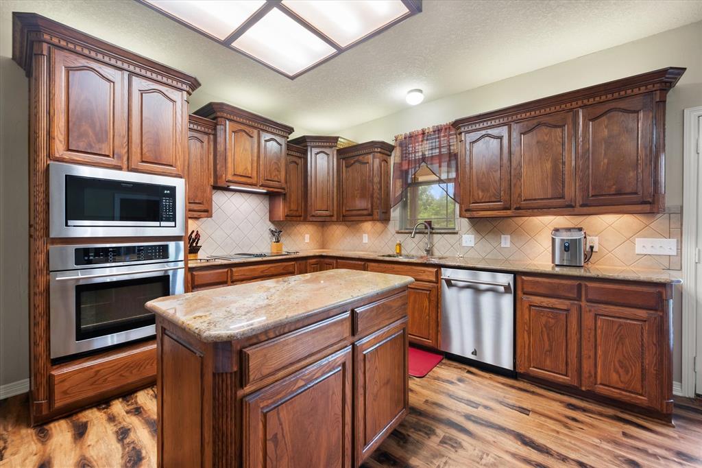 413 Rugged Drive Red Oak, TX 75154 - Photo 9 of 39 Tons of custom cabinets, island, stainless appliances