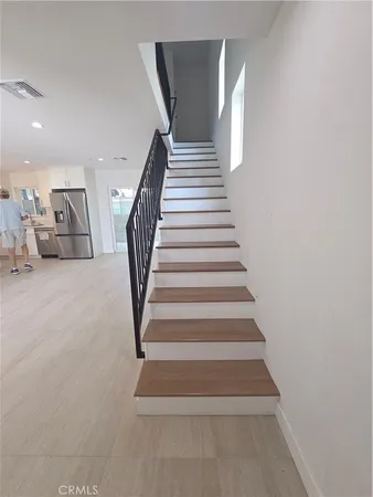 a bathroom with a sink mirror vanity and toilet
