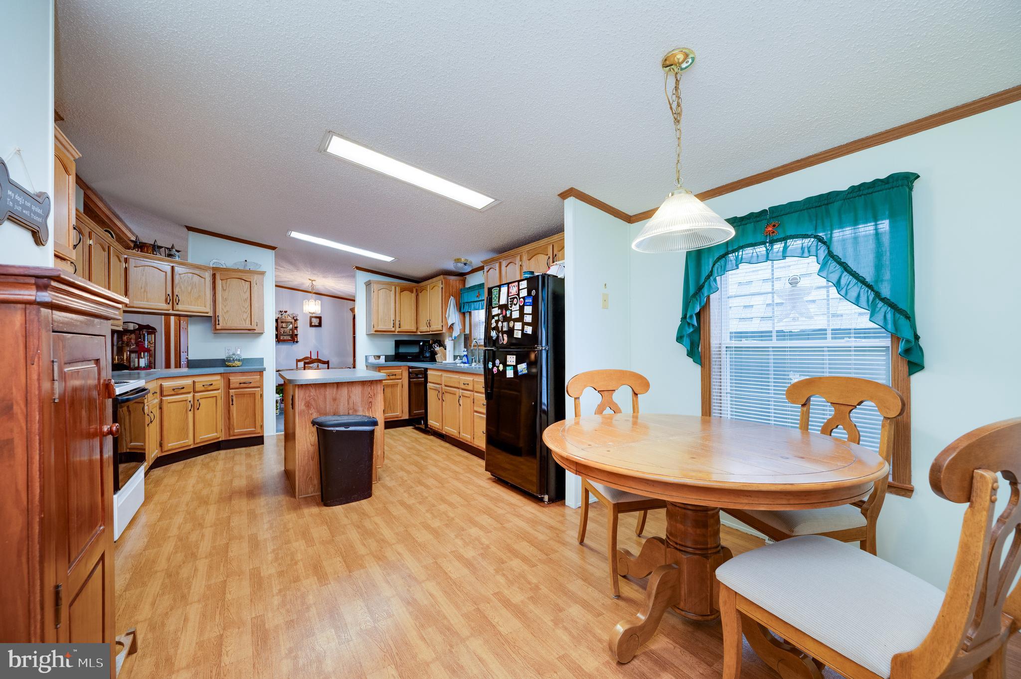 400 Allenbrook Lane Reading, PA 19606 - Photo 12 of 27 a dining room with a table or chairs and a wooden floor