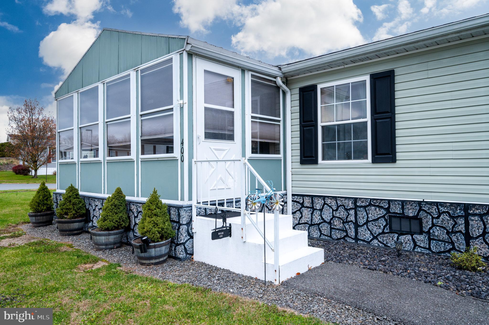 400 Allenbrook Lane Reading, PA 19606 - Photo 2 of 27 a front view of a house with a yard and outdoor seating