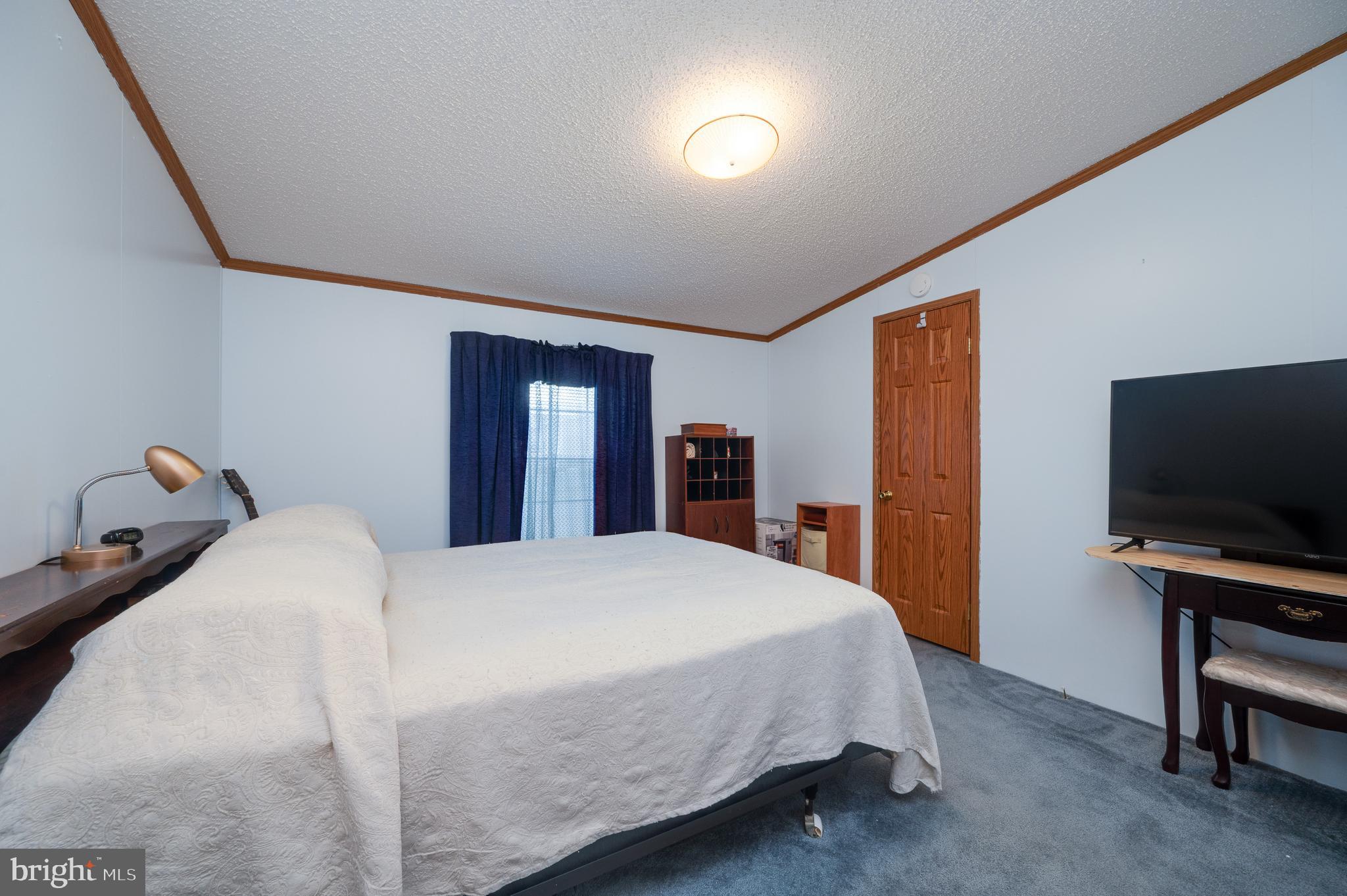 400 Allenbrook Lane Reading, PA 19606 - Photo 23 of 27 a bedroom with a bed and a flat screen tv