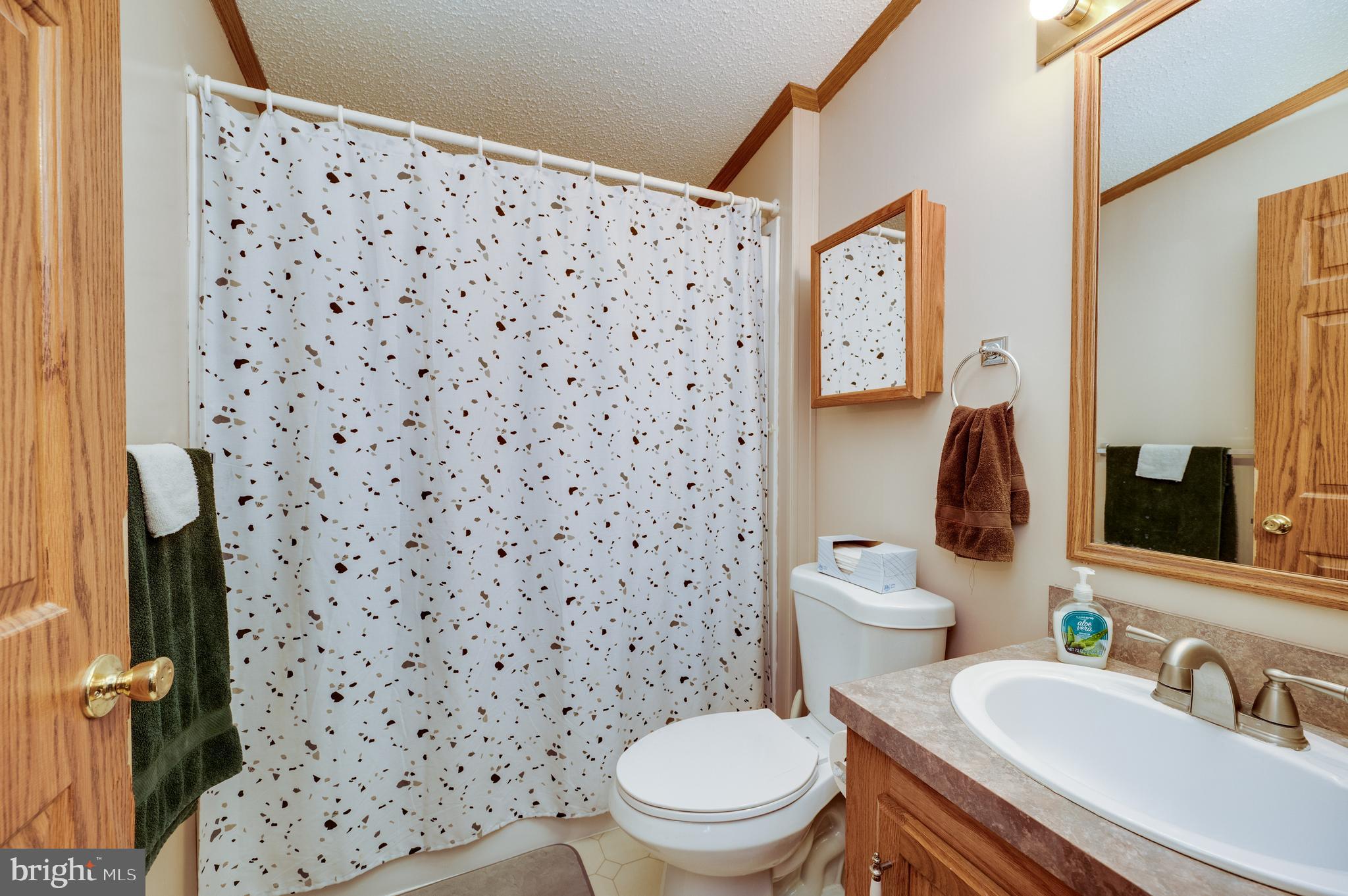 400 Allenbrook Lane Reading, PA 19606 - Photo 25 of 27 a white toilet sitting next to a bathroom sink