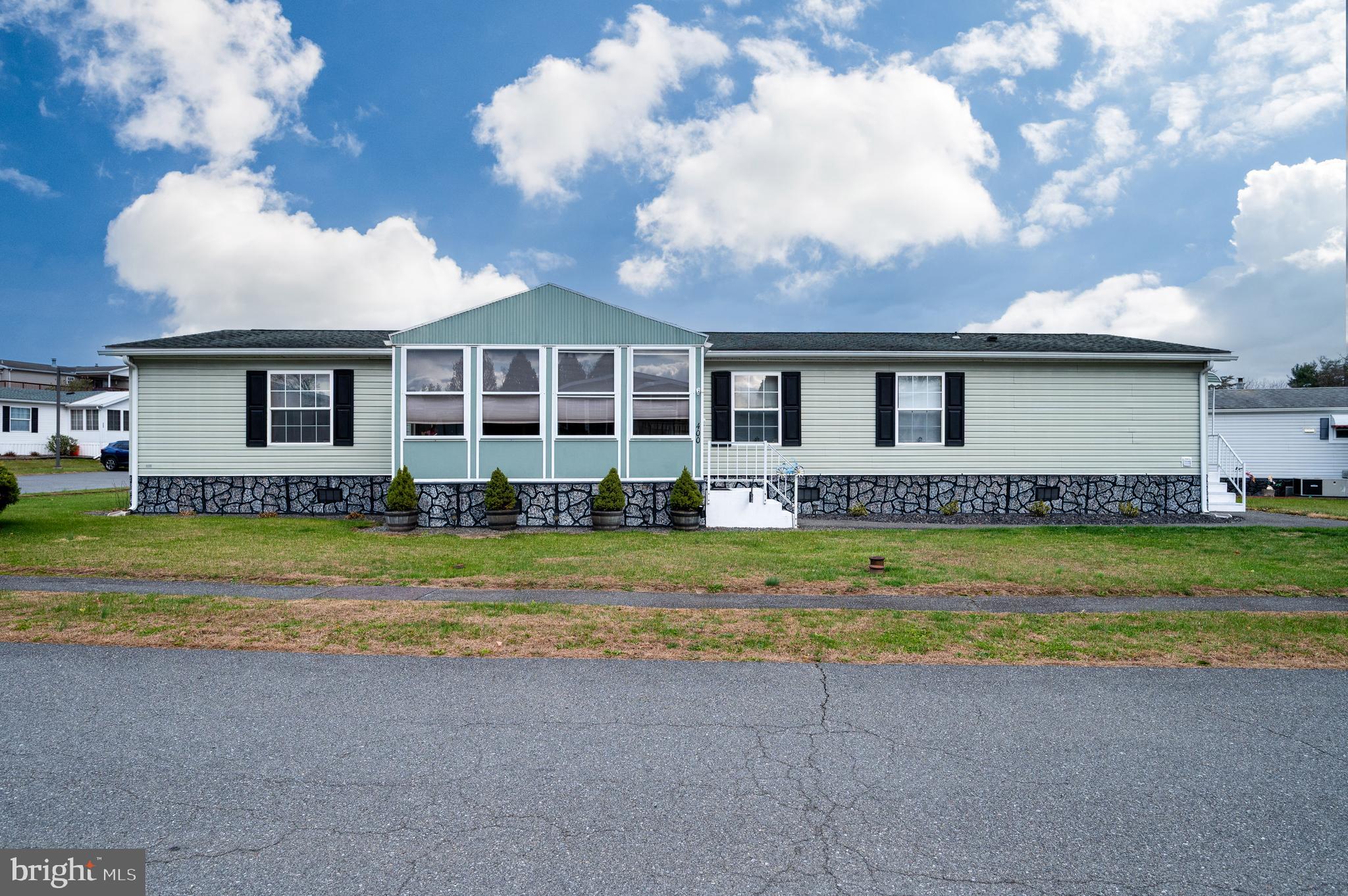 400 Allenbrook Lane Reading, PA 19606 - Photo 5 of 27 a front view of a house with a yard and swimming pool