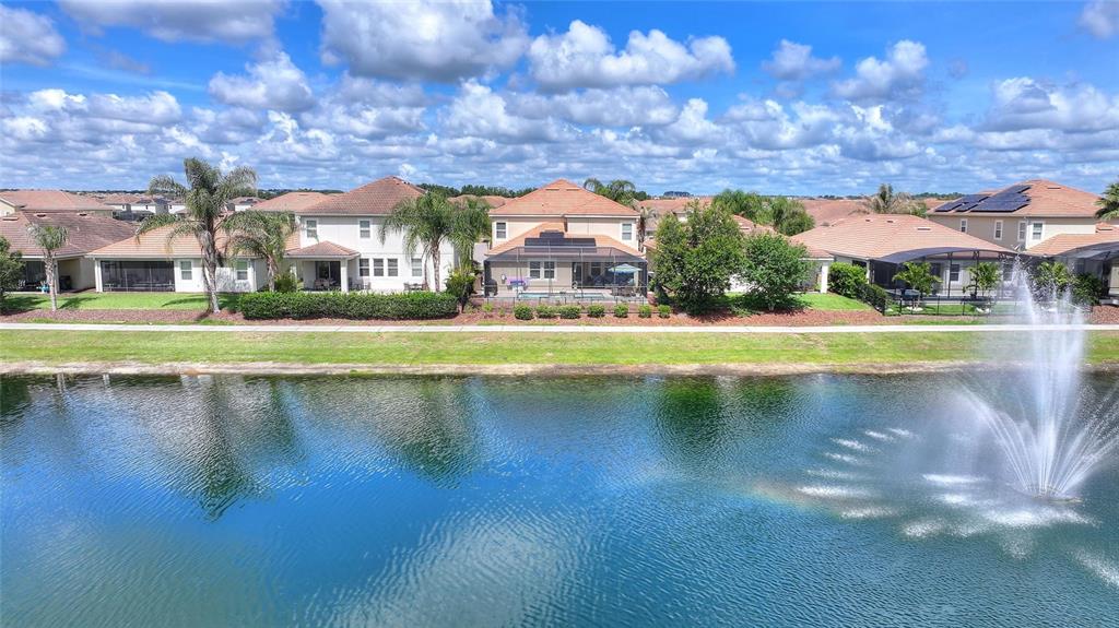1089 Blackwolf Run Road Davenport, FL 33896 - Photo 50 of 82 a view of swimming pool and lake view