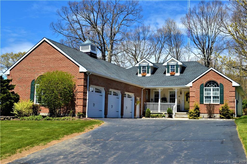 67 Jolie Road Naugatuck, CT 06770 - Photo 1 of 1 a front view of a house with a yard and garage