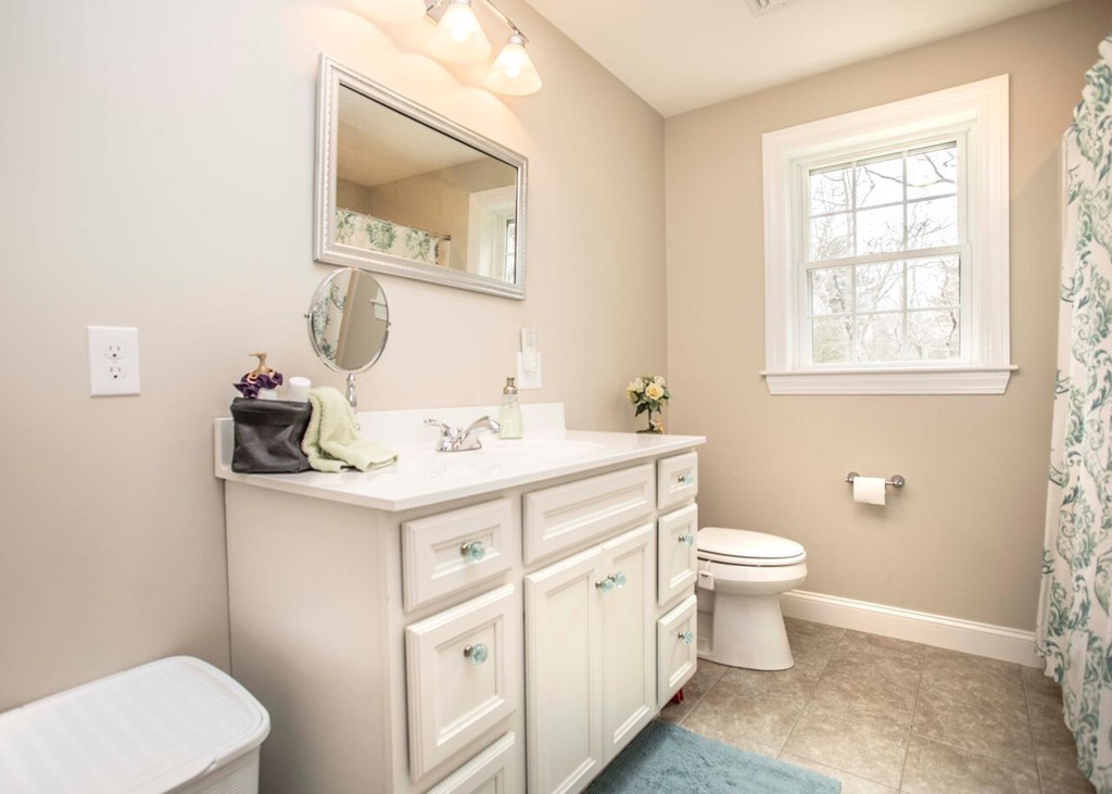 20 Strathmore Road East Bridgewater, MA 02333 - Photo 17 of 30 a bathroom with a toilet sink and mirror
