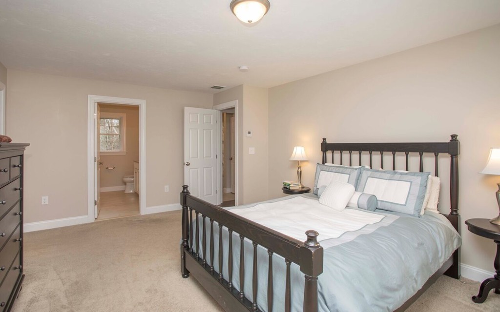 20 Strathmore Road East Bridgewater, MA 02333 - Photo 21 of 30 a bedroom with a bed and a chandelier