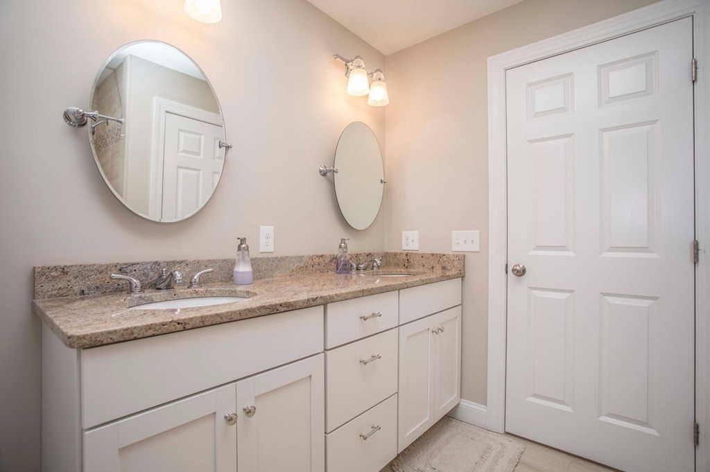 20 Strathmore Road East Bridgewater, MA 02333 - Photo 23 of 30 a en suite bathroom with a granite countertop double vanity sink and a mirror