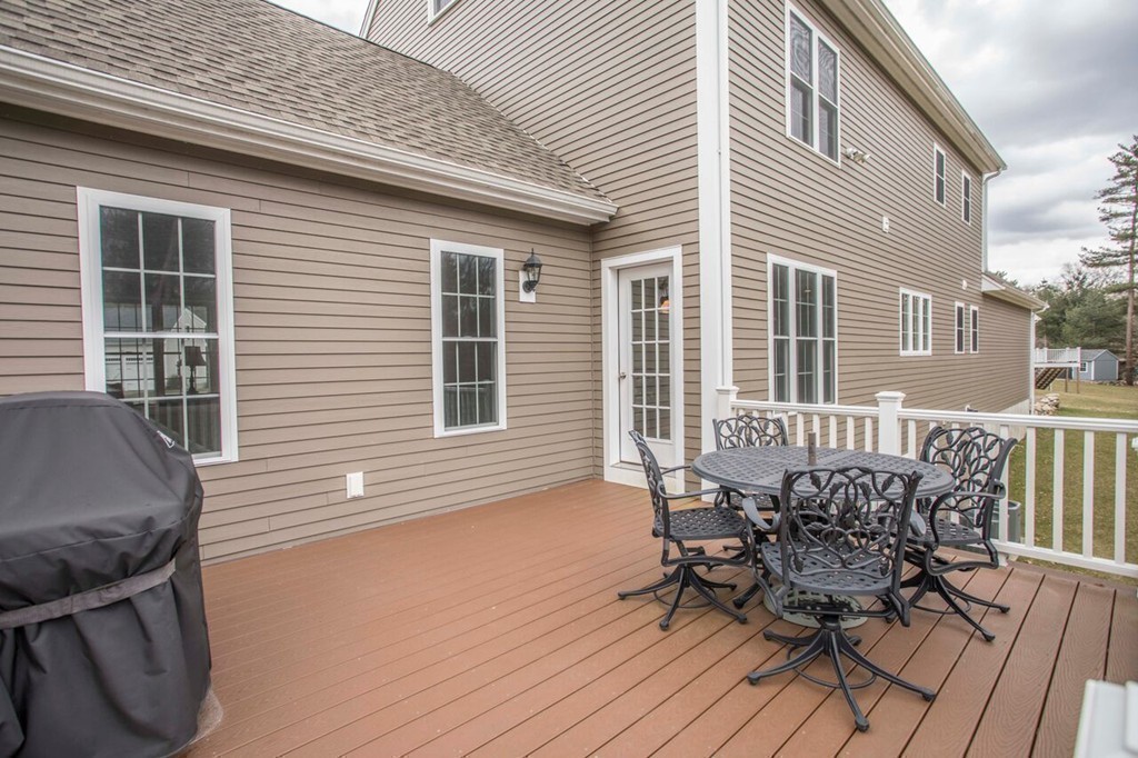 20 Strathmore Road East Bridgewater, MA 02333 - Photo 29 of 30 a view of a patio with table and chairs and wooden floor