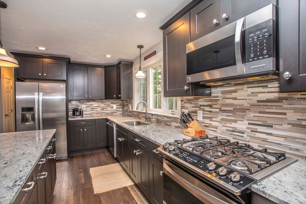 20 Strathmore Road East Bridgewater, MA 02333 - Photo 4 of 30 a kitchen with stainless steel appliances granite countertop a stove a sink and a refrigerator