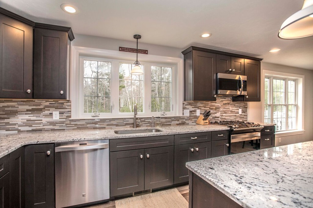 20 Strathmore Road East Bridgewater, MA 02333 - Photo 6 of 30 a kitchen with stainless steel appliances granite countertop a sink stove and oven