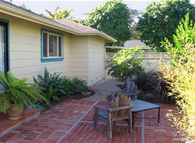 1663 Norte Way Santa Rosa, CA 95404 - Photo 3 of 7 a house with a table and a chairs