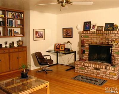 1663 Norte Way Santa Rosa, CA 95404 - Photo 4 of 7 a living room with furniture and a fireplace
