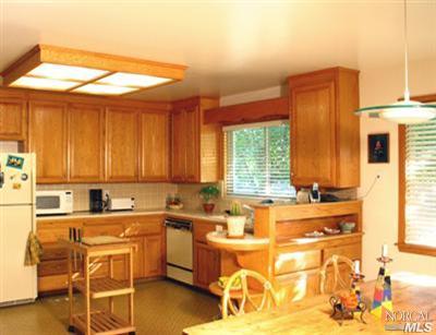 1663 Norte Way Santa Rosa, CA 95404 - Photo 6 of 7 a kitchen with a sink and cabinets