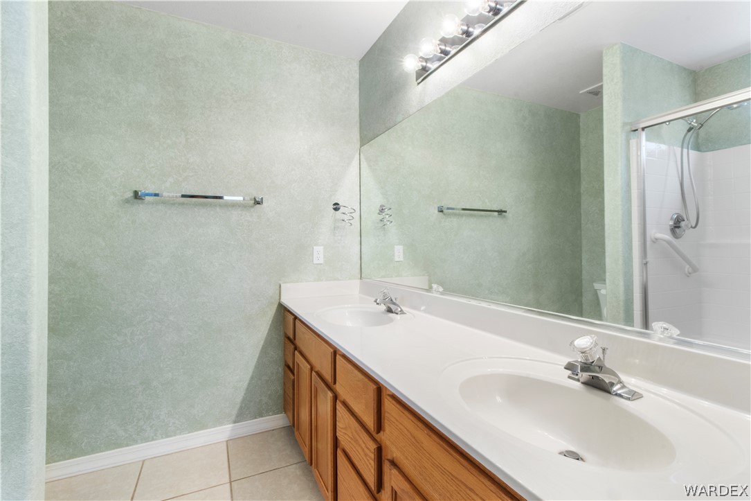 2158 Ranch Road Kingman, AZ 86401 - Photo 28 of 48 a bathroom with a sink and a mirror