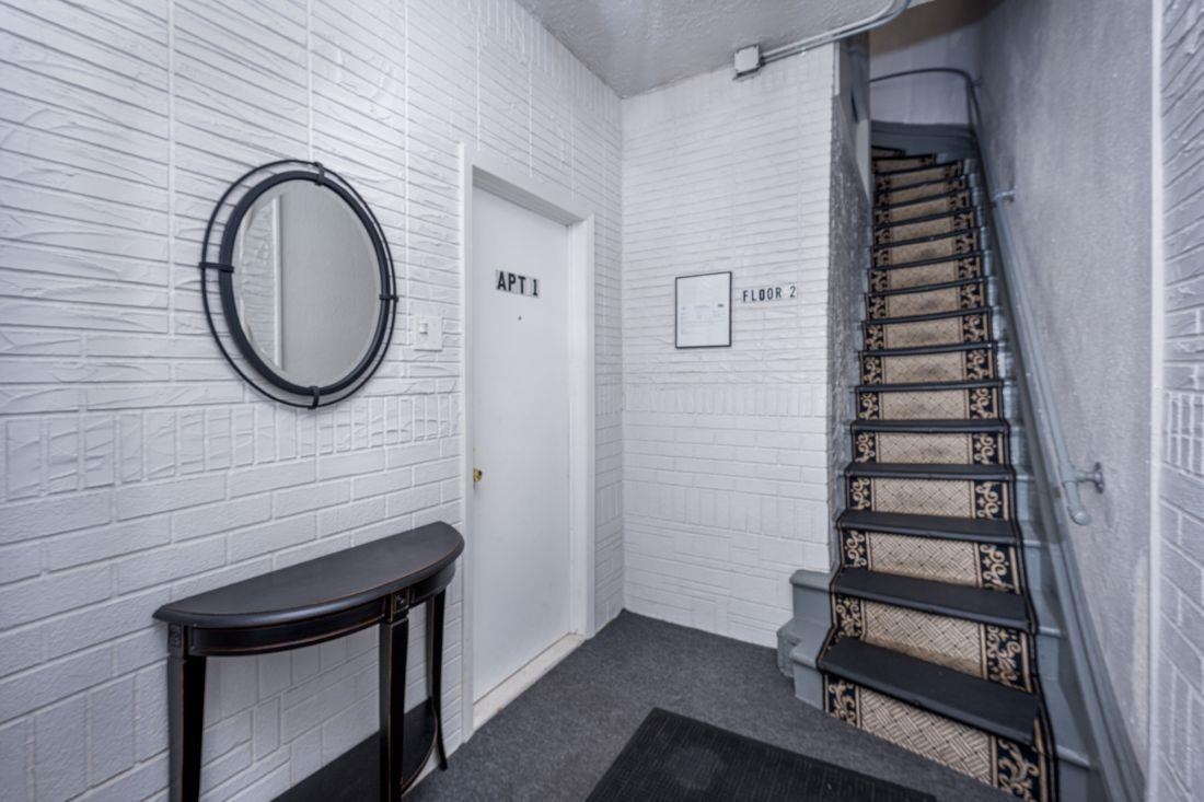 7 Magnolia Avenue, Unit 2 Jersey City, NJ 07306 - Photo 2 of 8 a bathroom with a sink a mirror and a shower