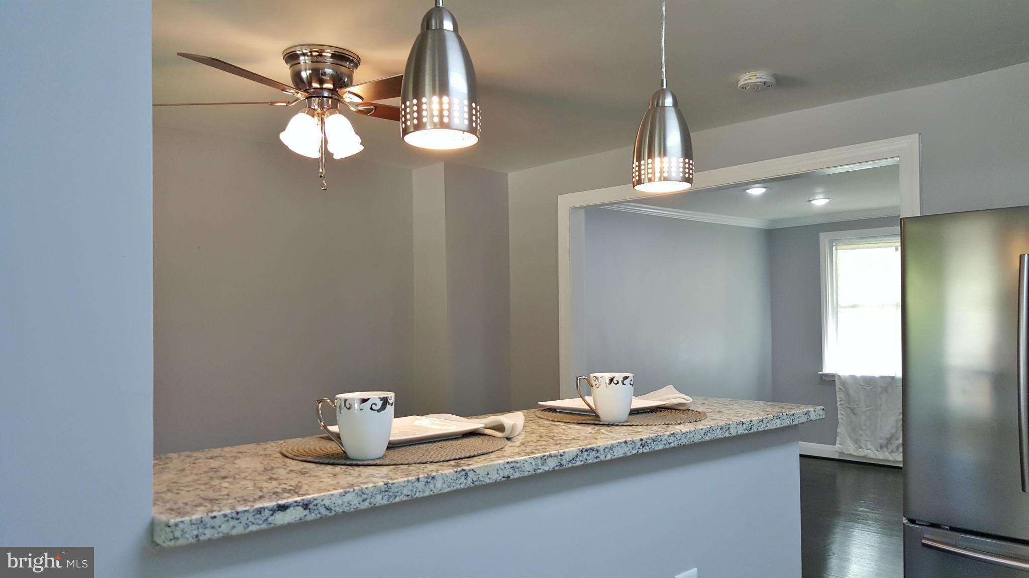8605 Oak Road Baltimore, MD 21234 - Photo 10 of 29 Breakfast bar opens to dining room