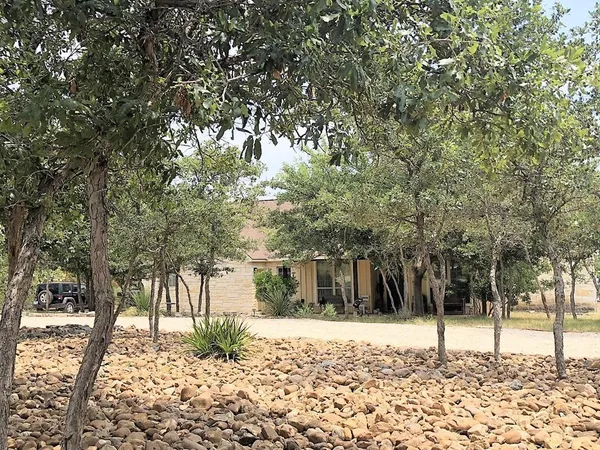 a house with trees in front of it
