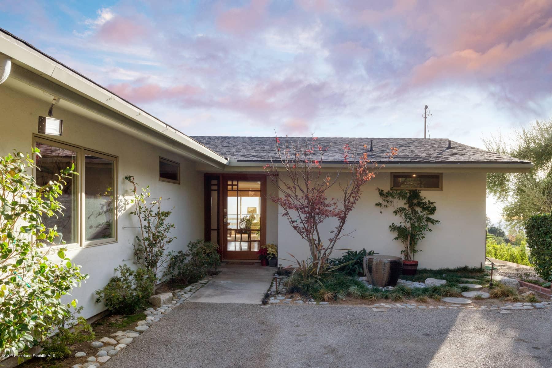 3430 Ellington Villa Drive Altadena, CA 91001 - Photo 2 of 49 a front view of a house with garden