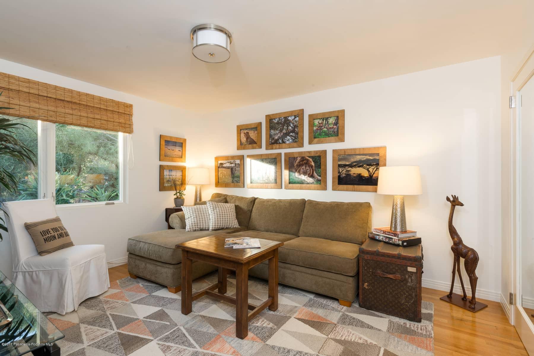 3430 Ellington Villa Drive Altadena, CA 91001 - Photo 25 of 49 a living room with furniture and floor to ceiling windows